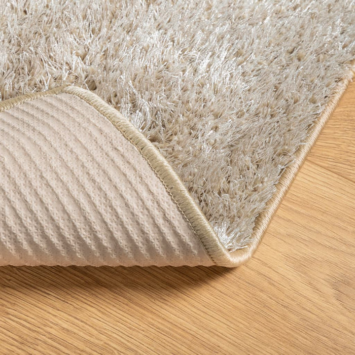 Teppe ISTAN med lang luv skinnende utseende beige 80x150 cm
