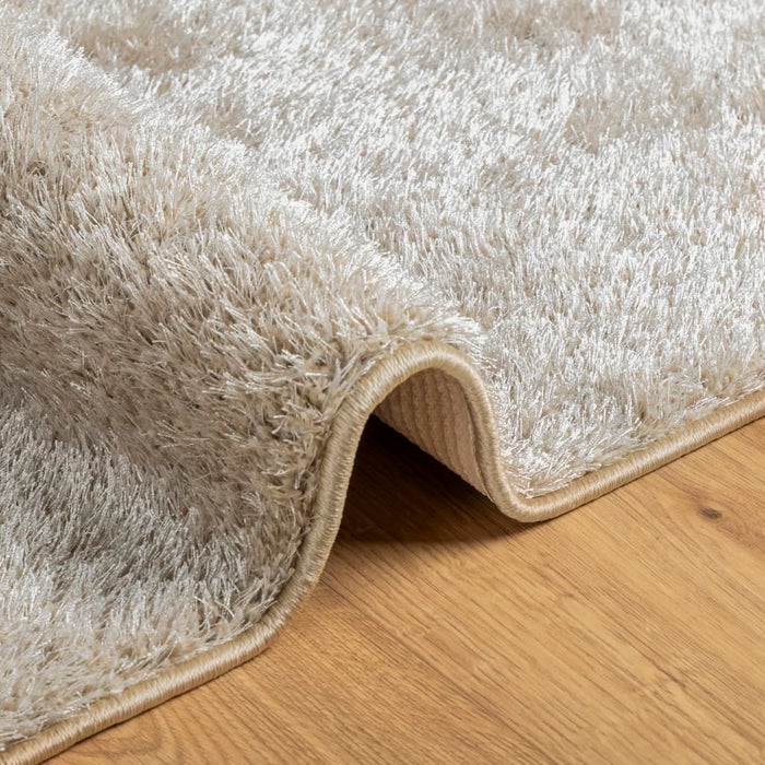 Teppe ISTAN med lang luv skinnende utseende beige 80x150 cm